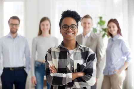 woman-with-people-behind-her.jpg.webp